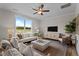 Bright living room with large windows, comfortable seating, and elegant decor at 55 Diamond Creek Dr, Zebulon, NC 27597