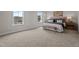 Light and bright main bedroom features neutral paint, carpet, and stylish decor at 55 Diamond Creek Dr, Zebulon, NC 27597