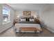 Neutral carpet and paint accent this main bedroom with beautiful decor at 55 Diamond Creek Dr, Zebulon, NC 27597