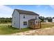 Two-story home with light blue siding and a covered back porch at 55 Diamond Creek Dr, Zebulon, NC 27597