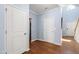 Welcoming foyer with hardwood floors, white trim, and convenient access to other rooms at 809 Davidson Point Rd, Cary, NC 27513