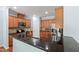 Modern kitchen with stainless steel appliances, dark countertops, and light-colored cabinets at 809 Davidson Point Rd, Cary, NC 27513