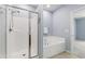 The main bathroom has a tub, walk-in shower, and a blue paint scheme at 809 Davidson Point Rd, Cary, NC 27513