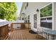 Relaxing outdoor wooden patio with chair set, ideal for outdoor dining at 809 Davidson Point Rd, Cary, NC 27513