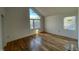 Bright bedroom with hardwood floors and large windows at 168 Daphine Dr, Hillsborough, NC 27278