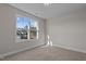 Spacious bedroom with neutral walls, carpeting, and large window with natural light at 22 Laramie Ln, Selma, NC 27576