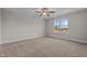 Comfortable bedroom featuring neutral carpet, large windows, and ample natural light at 22 Laramie Ln, Selma, NC 27576