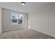 Neutral bedroom with carpet flooring and a large window providing ample natural light at 22 Laramie Ln, Selma, NC 27576