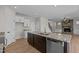 Kitchen island featuring a granite countertop with a view into the living room at 22 Laramie Ln, Selma, NC 27576