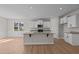 Modern kitchen with white cabinets, granite countertops, and stainless steel appliances at 22 Laramie Ln, Selma, NC 27576