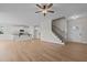 Open living room featuring hardwood floors, a kitchen island, and a staircase at 22 Laramie Ln, Selma, NC 27576