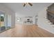 Bright living room flows into the kitchen, with sliding glass doors and staircase access at 22 Laramie Ln, Selma, NC 27576