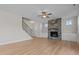 Spacious living room featuring a stone fireplace and hardwood floors at 22 Laramie Ln, Selma, NC 27576