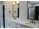 Double vanity bathroom with a large mirror and walk-in shower at 30 Basil Ct, Franklinton, NC 27525