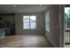 Bright dining area with hardwood floors and access to a back porch at 30 Basil Ct, Franklinton, NC 27525