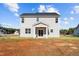 The home's back exterior showcases a covered porch and well-maintained gray siding at 41 Red River Dr, Selma, NC 27576