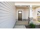 Charming front porch with stone accents, sturdy pillars, and a stylish front door at 41 Red River Dr, Selma, NC 27576
