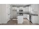 Stylish kitchen boasting white cabinets, stainless appliances, granite countertops and modern fixtures at 41 Red River Dr, Selma, NC 27576