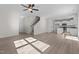 View of the open floor plan with the living room, staircase, and eat-in kitchen at 41 Red River Dr, Selma, NC 27576