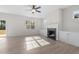Bright living room features a fireplace, built-in cabinets, and ceiling fan at 41 Red River Dr, Selma, NC 27576