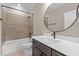 Bathroom features gray vanity, white countertop, and a bathtub at 55 Basil Ct, Franklinton, NC 27525