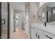 Modern bathroom with white vanity, marble countertop, and walk-in shower at 55 Basil Ct, Franklinton, NC 27525
