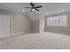 Spacious bedroom featuring a ceiling fan and large window with natural light at 55 Basil Ct, Franklinton, NC 27525