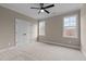 Simple bedroom with carpet, ceiling fan, and double door closet at 55 Basil Ct, Franklinton, NC 27525