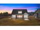 Two-story house back view, featuring a screened porch and landscaped yard at 55 Basil Ct, Franklinton, NC 27525