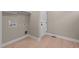 Bright laundry room with a door and vinyl flooring at 55 Basil Ct, Franklinton, NC 27525