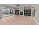Living room with hardwood floors, fireplace, built-in shelves, and access to patio at 55 Basil Ct, Franklinton, NC 27525