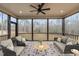 Relaxing screened-in porch with comfortable seating and an outdoor view at 55 Basil Ct, Franklinton, NC 27525