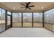 Relaxing screened porch with ceiling fan, offering wooded views at 55 Basil Ct, Franklinton, NC 27525