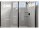 Clean shower with gray tile and glass enclosure at 55 Basil Ct, Franklinton, NC 27525