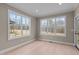 Sunroom with light walls, hardwood floors, and large windows at 55 Basil Ct, Franklinton, NC 27525