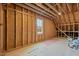 Unfinished attic room with window, offering potential for future development at 55 Basil Ct, Franklinton, NC 27525