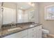 Bathroom with granite countertops, double sinks, and a shower at 927 Micro W Rd, Selma, NC 27576