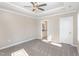 Spacious bedroom with carpet flooring and ceiling fan at 927 Micro W Rd, Selma, NC 27576