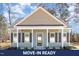 Charming single-story home with a welcoming front porch, well-maintained landscaping, and neutral color palette at 927 Micro W Rd, Selma, NC 27576