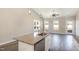 Modern kitchen with white cabinets, granite countertops and island at 927 Micro W Rd, Selma, NC 27576