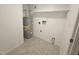 The laundry room offers space for a washer and dryer and has a water heater at 108 N Woodshed Ct, Cary, NC 27513