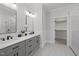 Elegant bathroom with dual vanities, a large shower, and a walk-in closet at 184 Dereham Ln, Garner, NC 27529