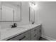 Double vanity bathroom with gray cabinets and quartz countertop at 184 Dereham Ln, Garner, NC 27529
