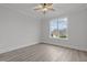 Bright, neutral bedroom with a large window offering neighborhood views at 184 Dereham Ln, Garner, NC 27529