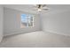 Spacious bedroom with large window and ceiling fan at 184 Dereham Ln, Garner, NC 27529