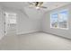 Bright bedroom with window, closet, and ceiling fan at 184 Dereham Ln, Garner, NC 27529