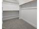 Large walk-in closet with hanging rods and shelves at 184 Dereham Ln, Garner, NC 27529