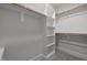 Spacious walk-in closet with built-in shelves and hanging rods at 184 Dereham Ln, Garner, NC 27529