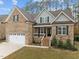 Two-story brick home with a double garage at 184 Dereham Ln, Garner, NC 27529