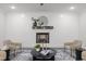 Modern fireplace with a sleek mantel and shiplap wall, adding a focal point to the room at 184 Dereham Ln, Garner, NC 27529